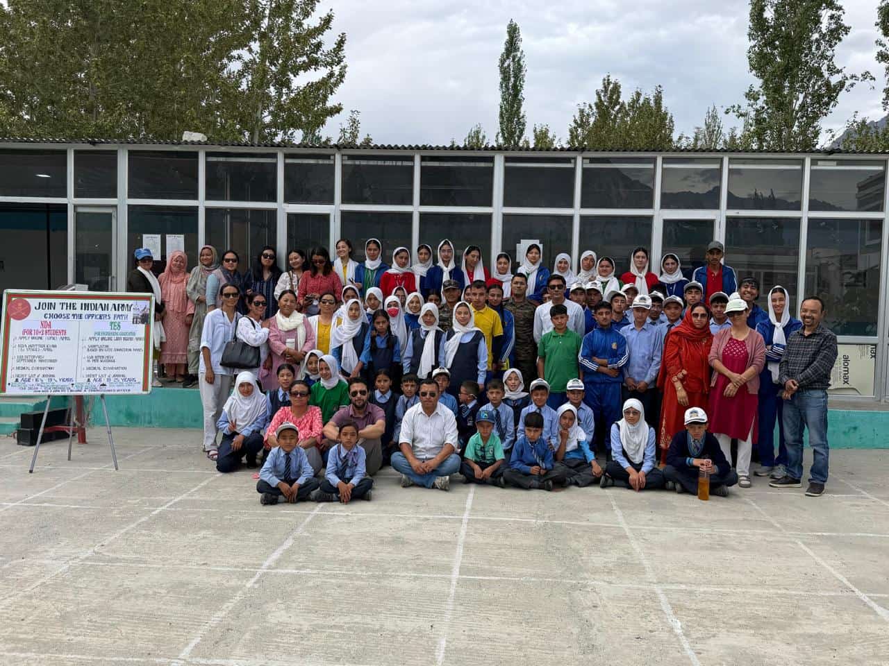 Large group photograph of students, staff and guests after an Army career awareness programme